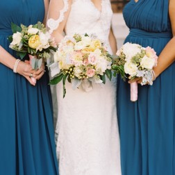 blue teal bridesmaids dresses and bridesmaid's bouquets in a Washington DC wedding coordinated by Glow Weddings and Events